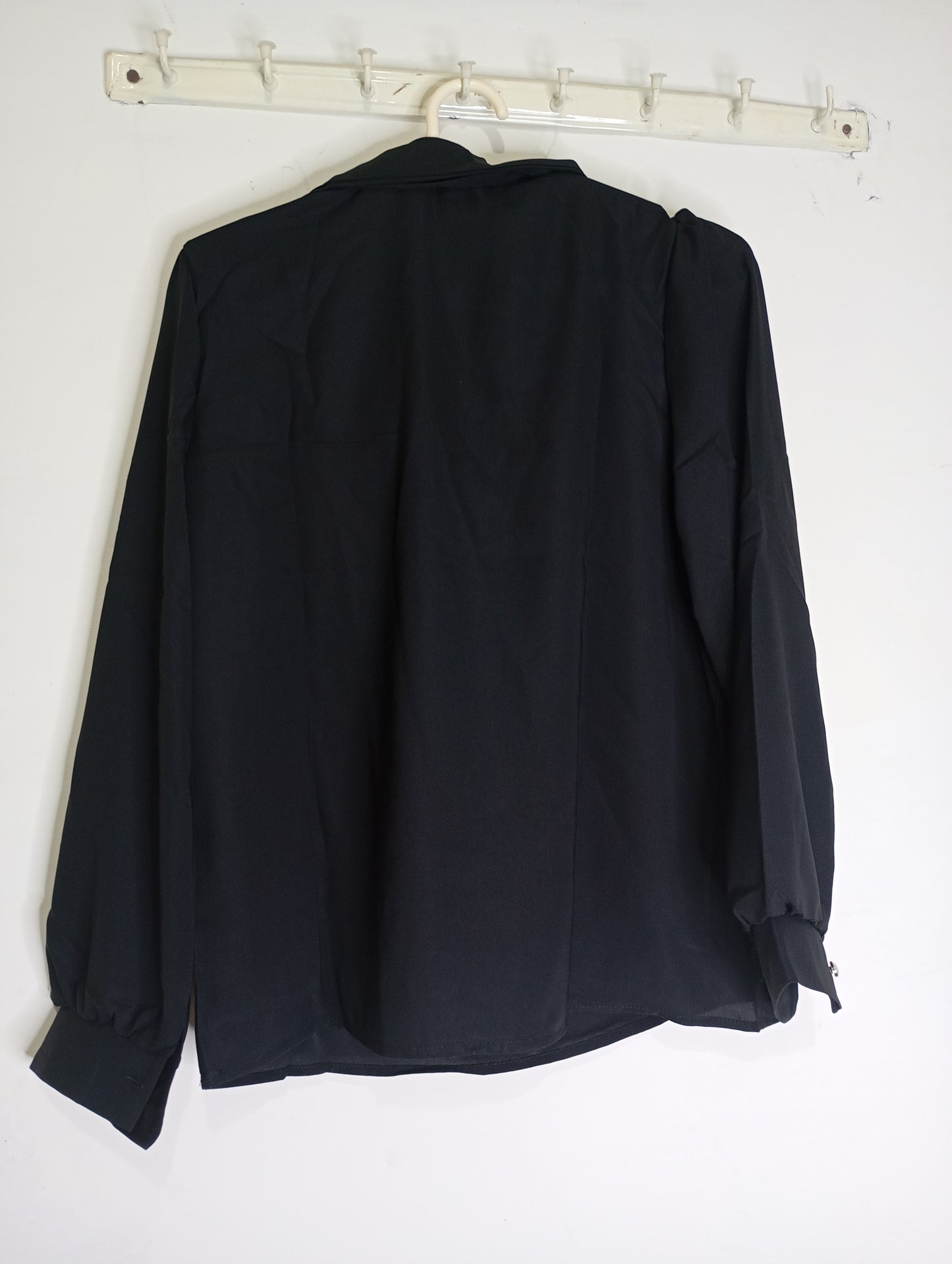 black top with decorative tie