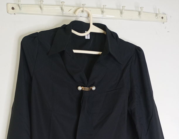 black top with decorative tie