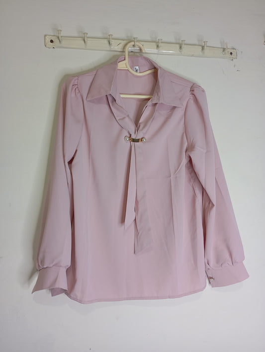pink top with decorative tie