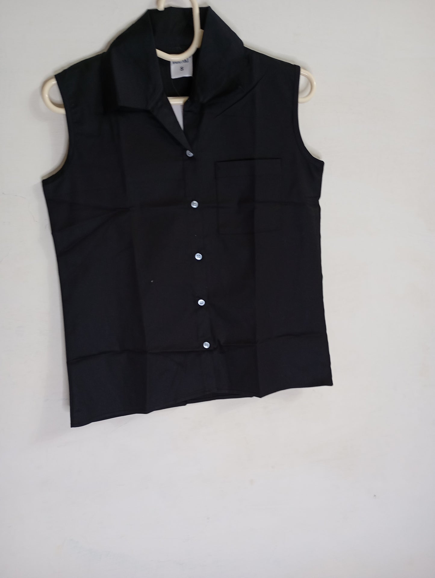 Black sleevless button down shirt
