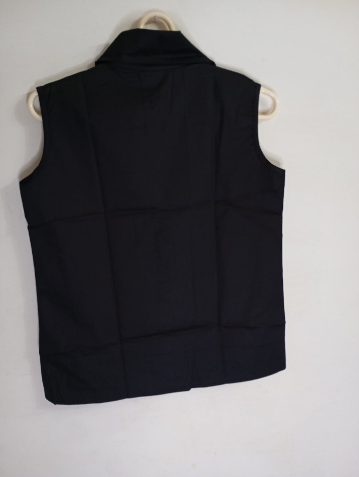 Black sleevless button down shirt