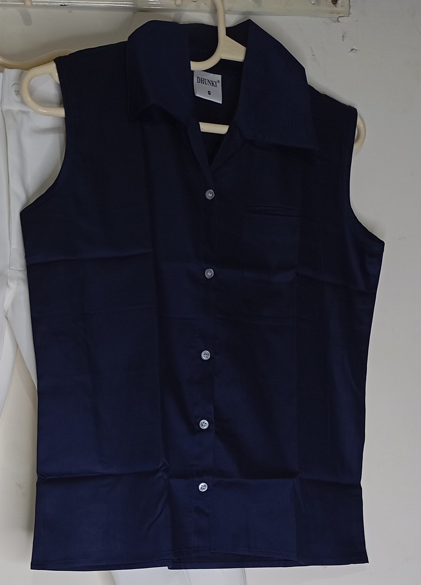 WHITE PANT WITH BLUE SLEEVELESS SHIRT