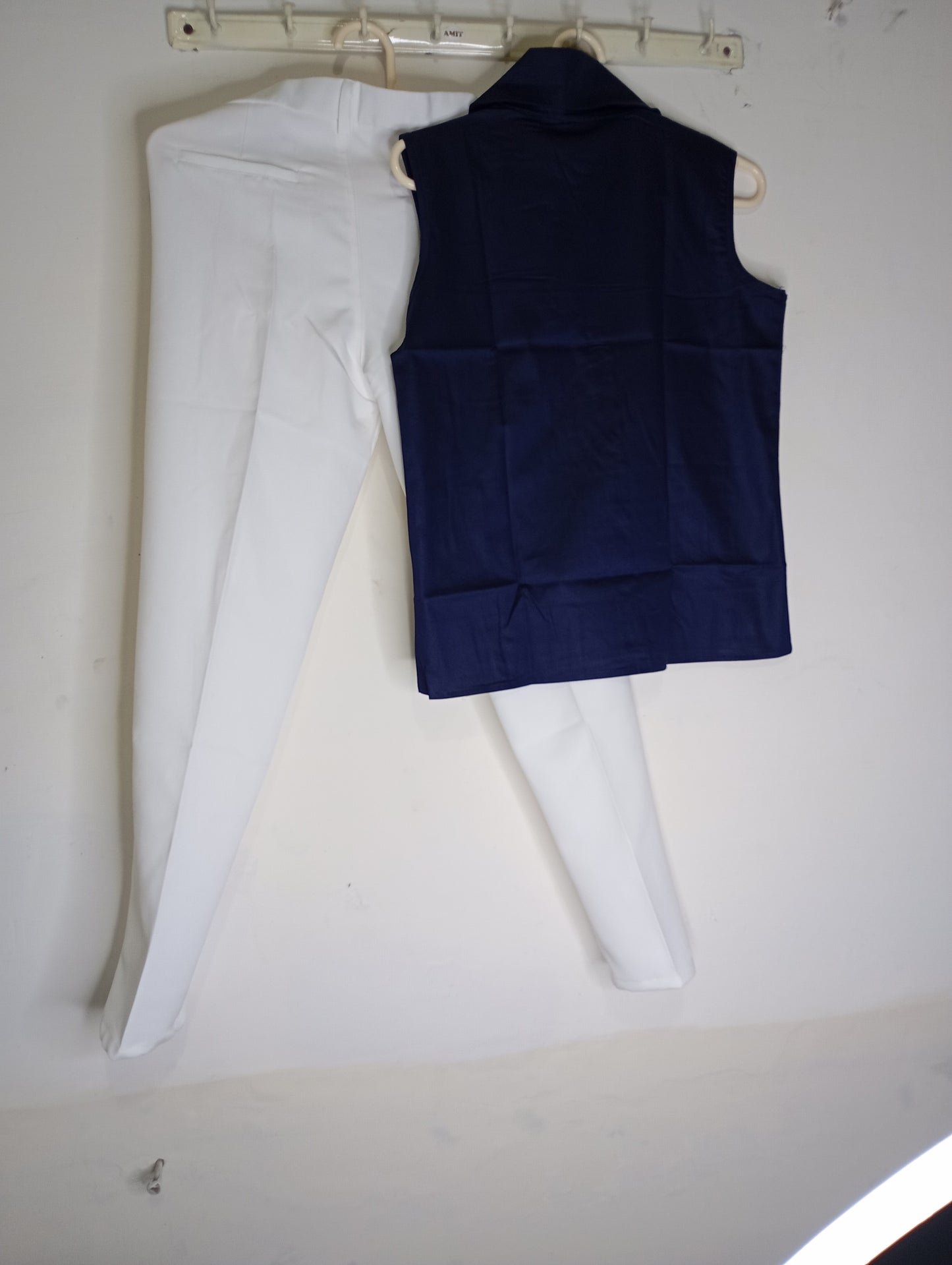 WHITE PANT WITH BLUE SLEEVELESS SHIRT
